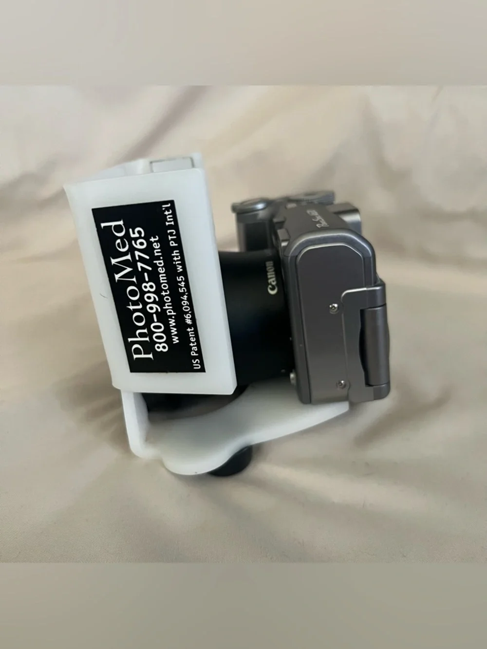 Canon PowerShot A620 digital camera with Photomed dental photography attachment